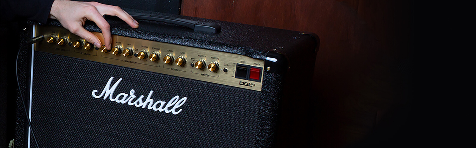 Marshall guitar amp being adjusted