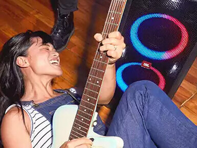 girl playing electric guitar