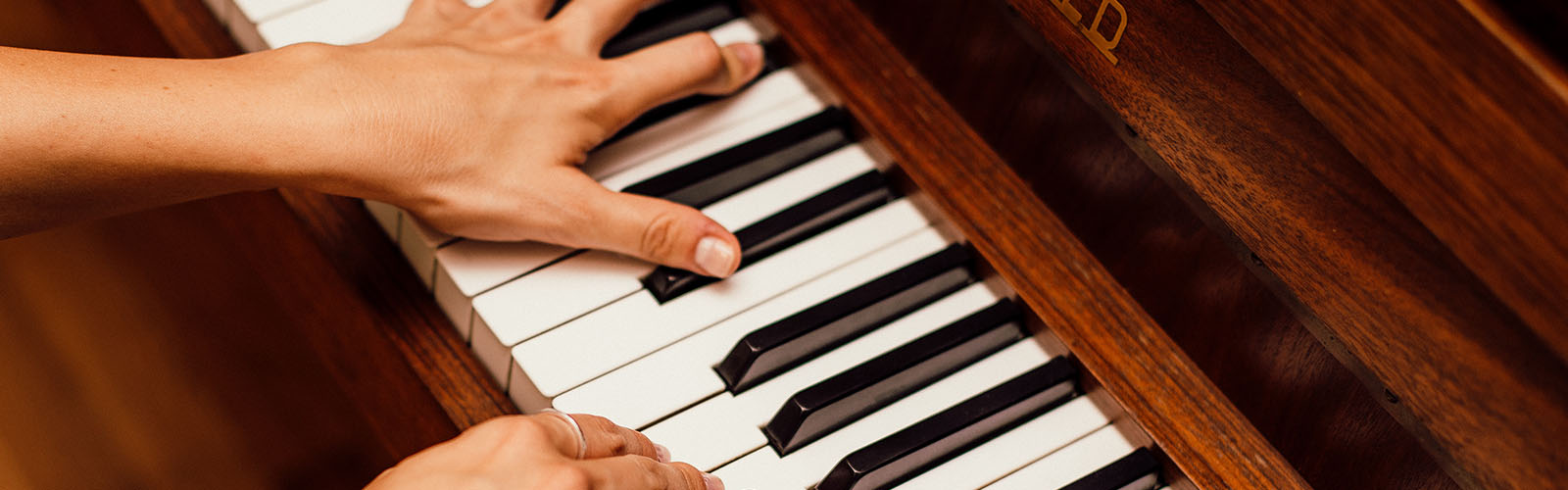 Hands playing piano